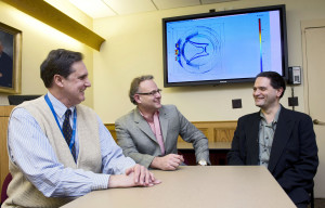 Discussing the spinal cord stimulation modeling results. From left: Kris Carlson, Ph.D.,  and Doctors Jeffrey Arle, and Jay Shils. All with the Neuromodulation Group at Lahey  Clinic in Burlington, MA.